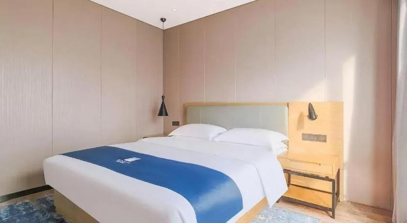 Bed in Echarm Hotel Danzhou Xiari Plaza