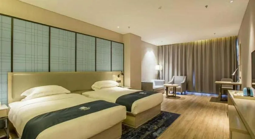 Bed in Echarm Hotel Danzhou Xiari Plaza
