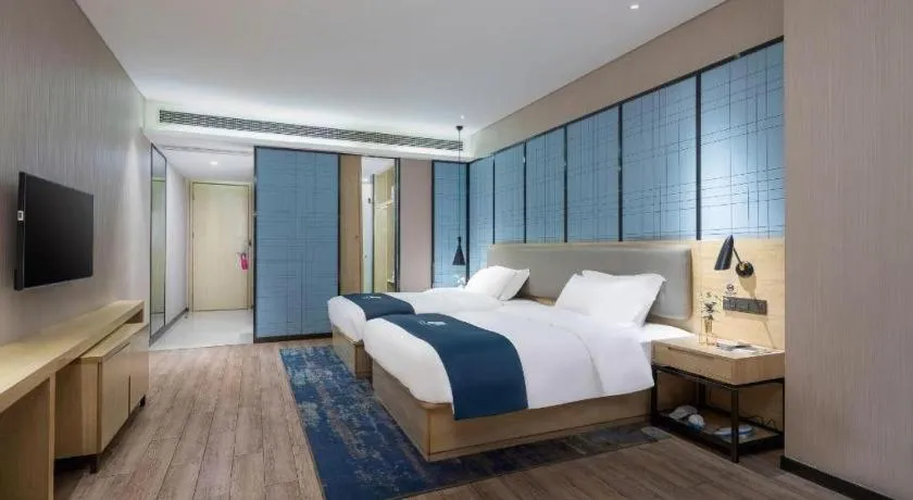 Bed in Echarm Hotel Danzhou Xiari Plaza