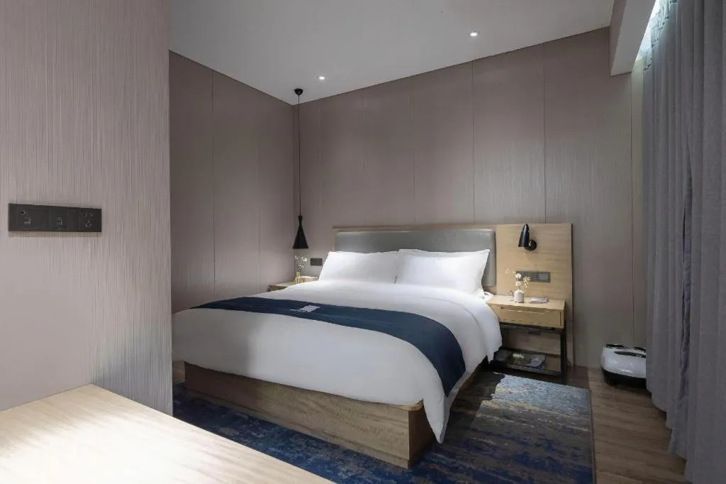 Bed in Echarm Hotel Danzhou Xiari Plaza