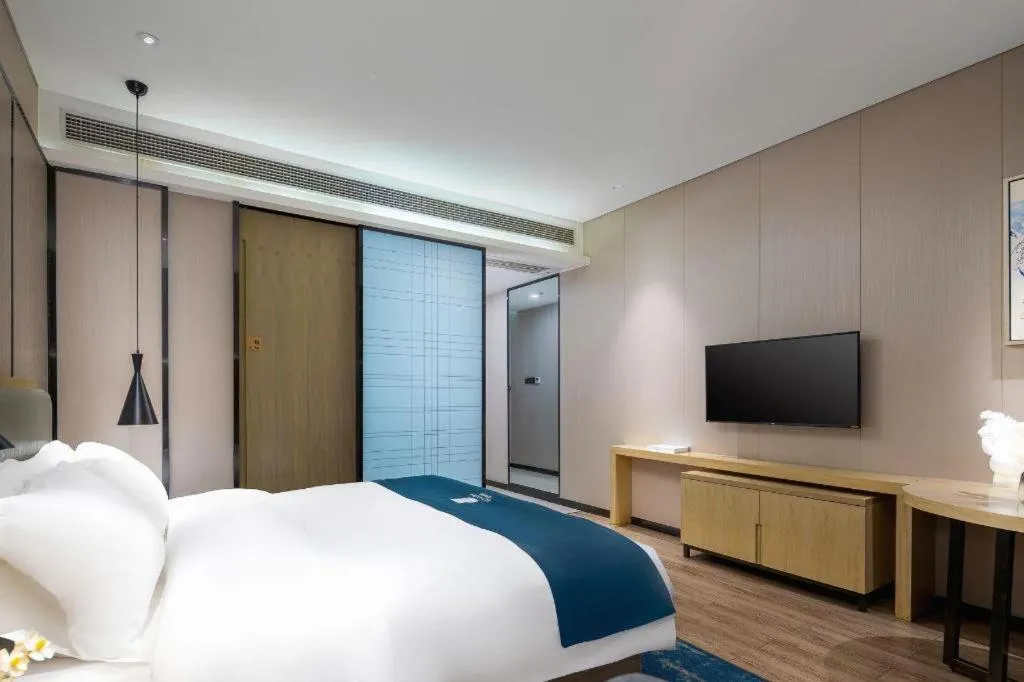 Bed in Echarm Hotel Danzhou Xiari Plaza