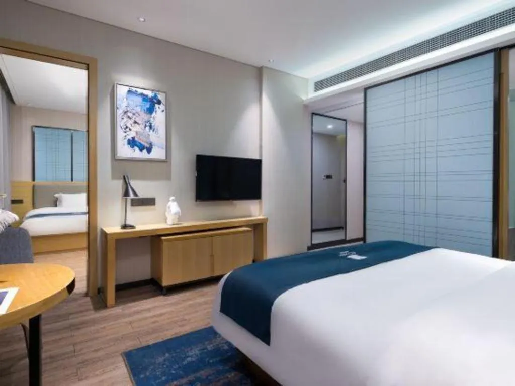 Bed in Echarm Hotel Danzhou Xiari Plaza