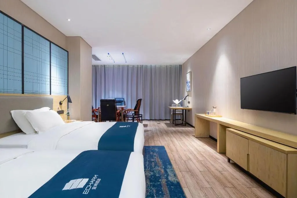 Bed in Echarm Hotel Danzhou Xiari Plaza