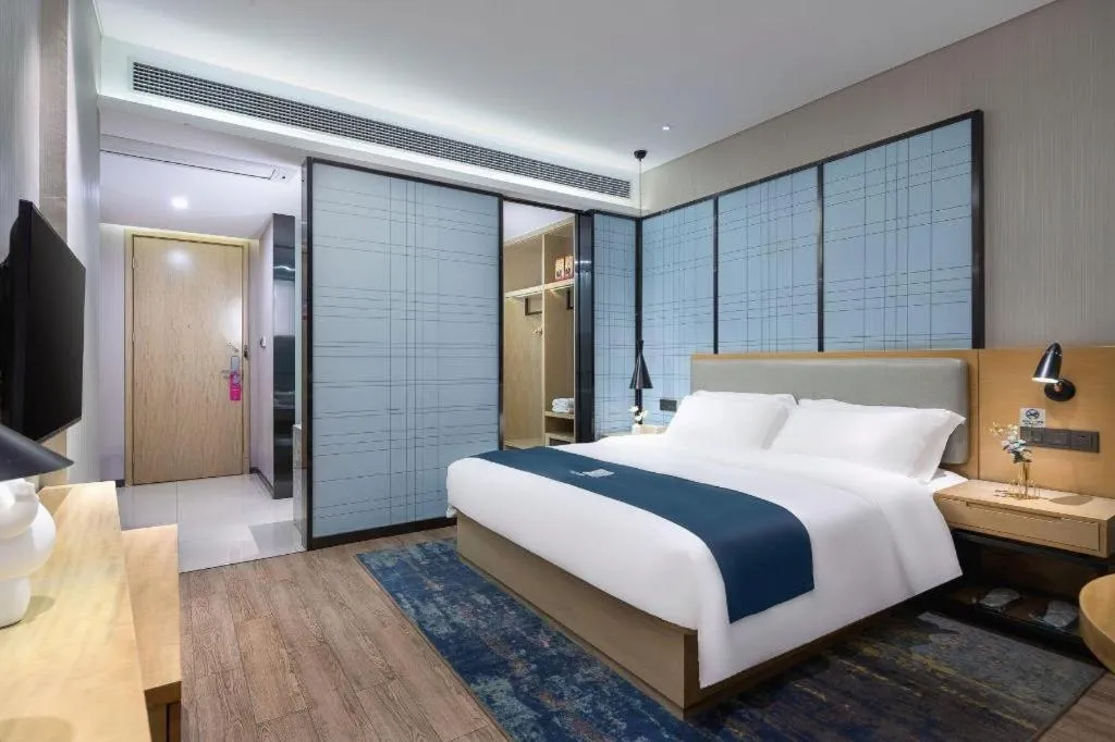 Bed in Echarm Hotel Danzhou Xiari Plaza