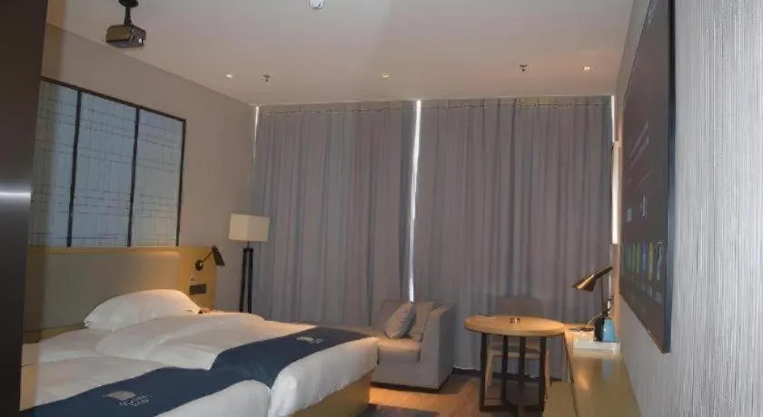 Bed in Echarm Hotel Danzhou Xiari Plaza