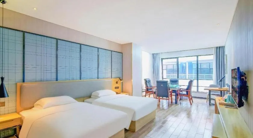 Bed in Echarm Hotel Danzhou Xiari Plaza