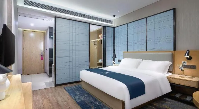 Bed in Echarm Hotel Danzhou Xiari Plaza