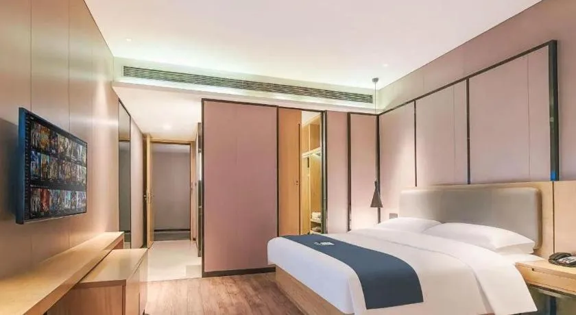 Bed in Echarm Hotel Danzhou Xiari Plaza