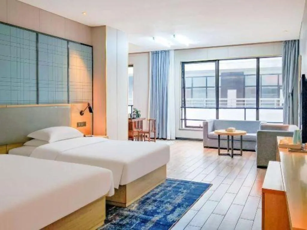 Bed in Echarm Hotel Danzhou Xiari Plaza