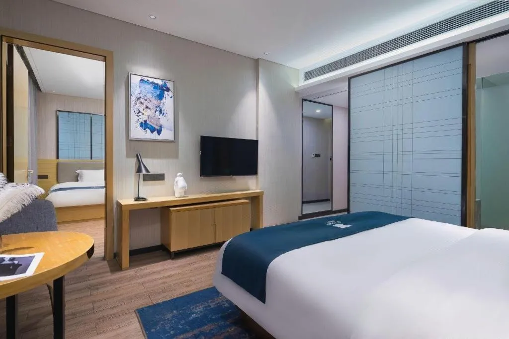 Bed in Echarm Hotel Danzhou Xiari Plaza