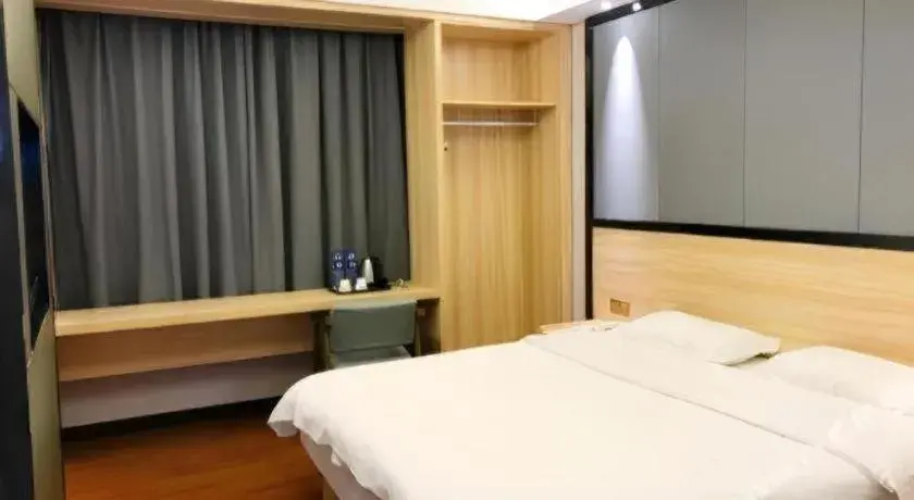 Bed in Wenxing Hotel Guangzhou Gangding Metro Station Branch Bed in Wenxing Hotel Guangzhou Gangding Metro Station Branch