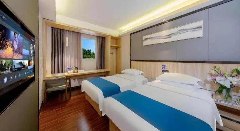 Bed in Wenxing Hotel Guangzhou Gangding Metro Station Branch