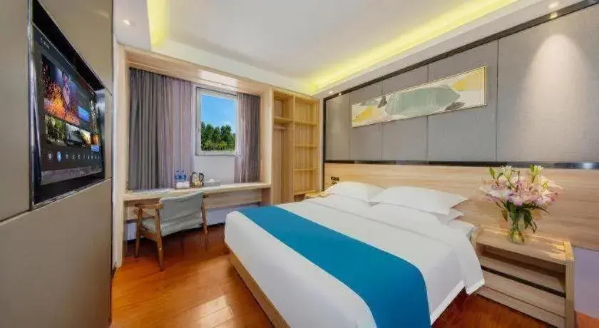 Bed in Wenxing Hotel Guangzhou Gangding Metro Station Branch Bed in Wenxing Hotel Guangzhou Gangding Metro Station Branch