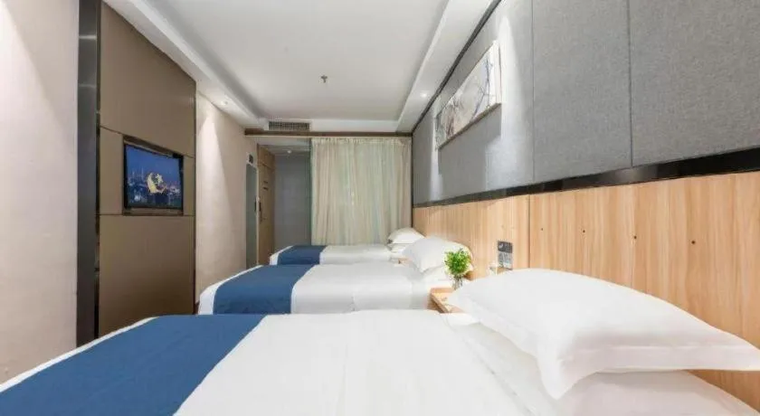 Bed in Wenxing Hotel Guangzhou Gangding Metro Station Branch