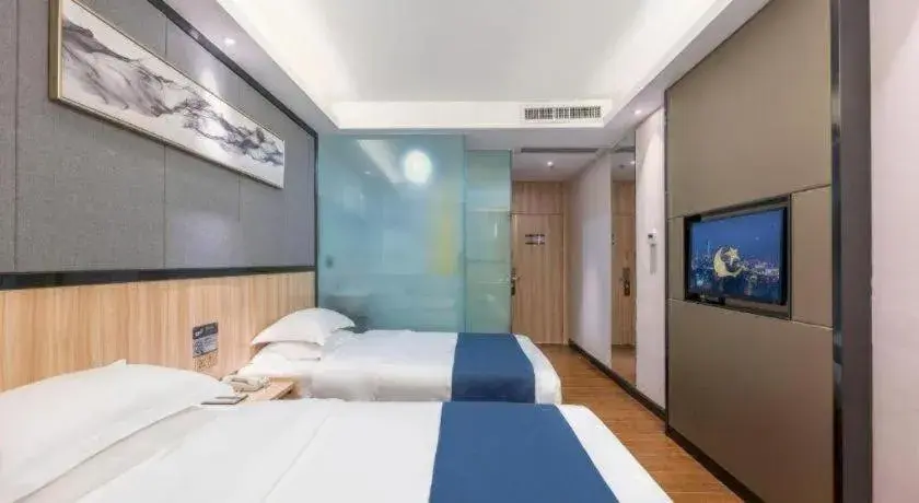 Bed in Wenxing Hotel Guangzhou Gangding Metro Station Branch Bed in Wenxing Hotel Guangzhou Gangding Metro Station Branch