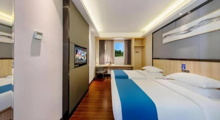 Bed in Wenxing Hotel Guangzhou Gangding Metro Station Branch