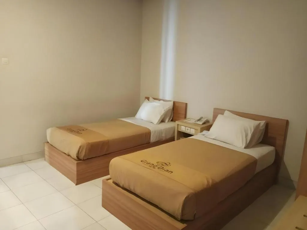 Bed in Grand Dian Hotel Slawi