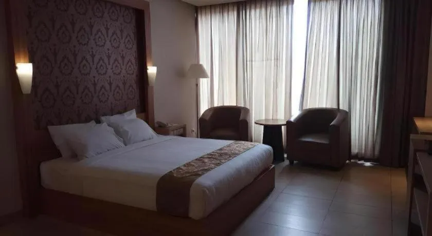 Bed in Grand Dian Hotel Slawi