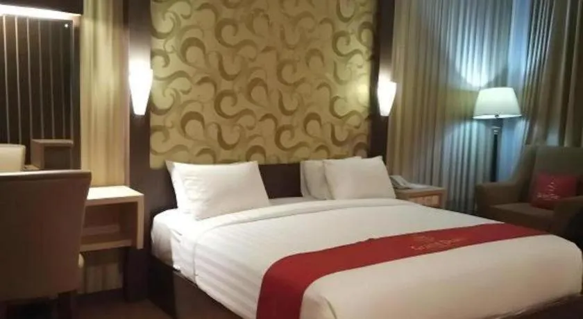 Bed in Grand Dian Hotel Slawi