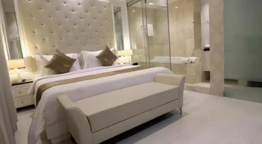 Bed in Grand Darmo Suite by AMITHYA Bed in Grand Darmo Suite by AMITHYA
