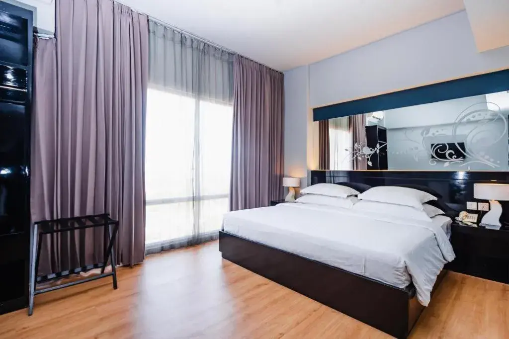 Bed in Grand Darmo Suite by AMITHYA Bed in Grand Darmo Suite by AMITHYA