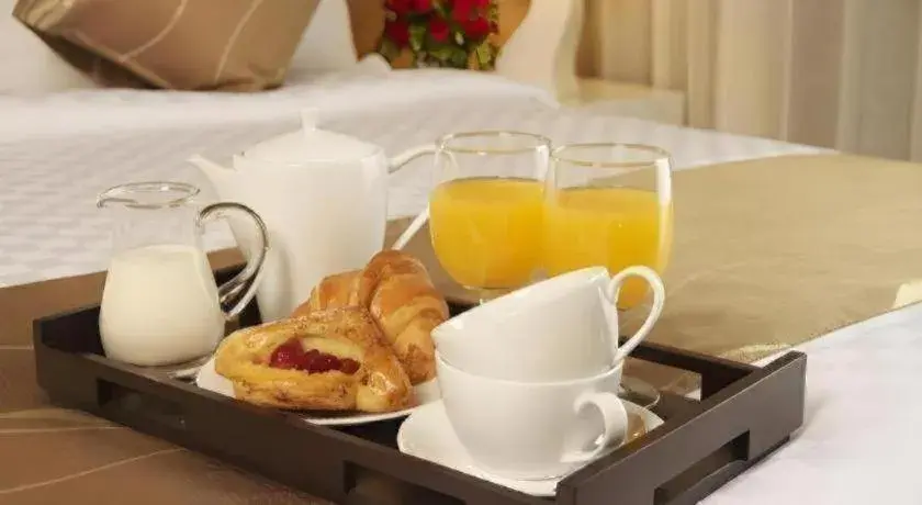 Bed in Grand Darmo Suite by AMITHYA Bed in Grand Darmo Suite by AMITHYA