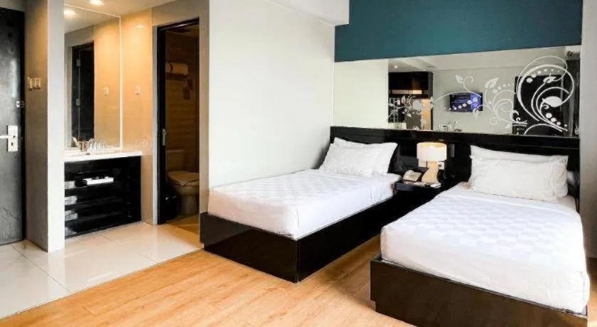 Bed in Grand Darmo Suite by AMITHYA