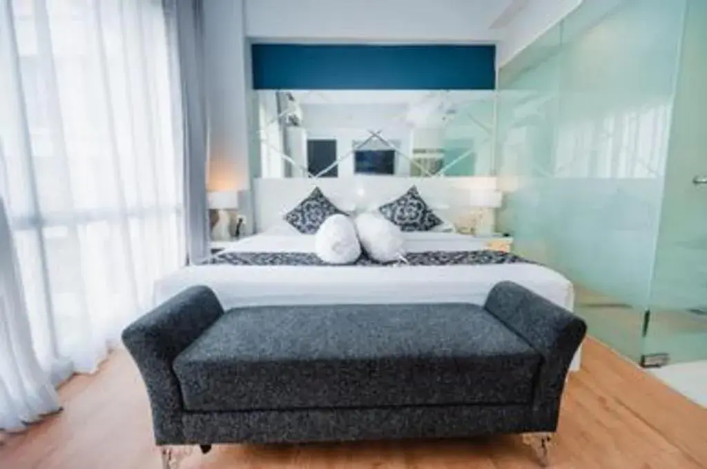 Bed in Grand Darmo Suite by AMITHYA Bed in Grand Darmo Suite by AMITHYA
