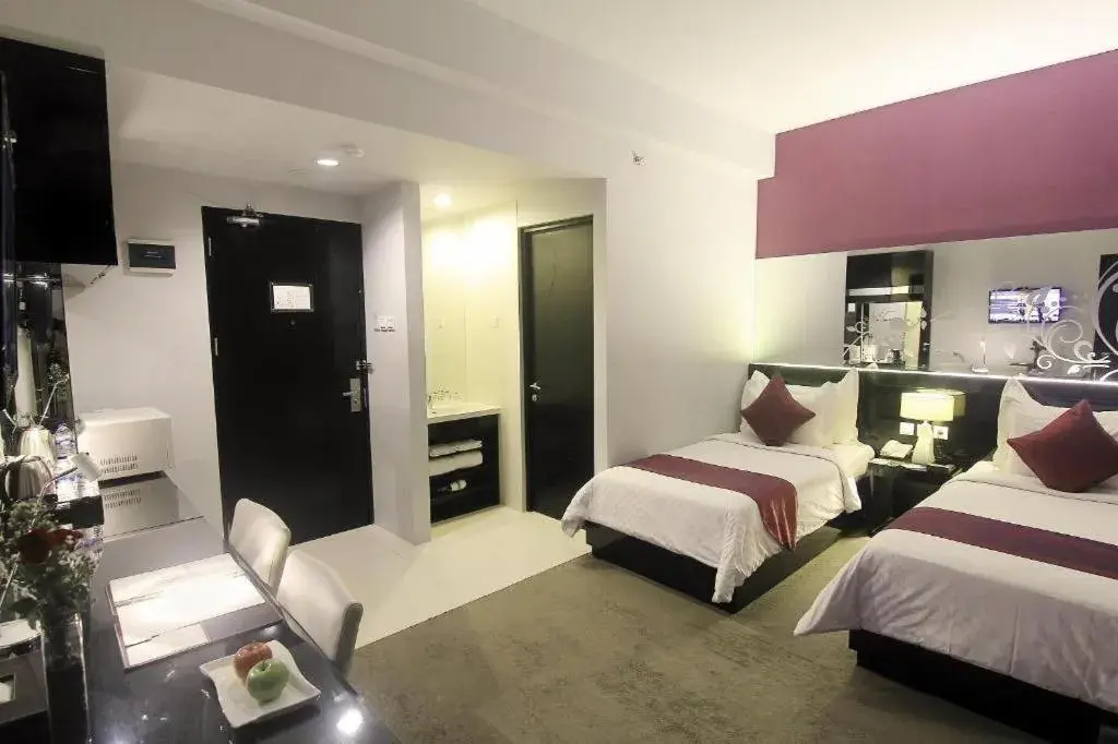 Bed in Grand Darmo Suite by AMITHYA Bed in Grand Darmo Suite by AMITHYA