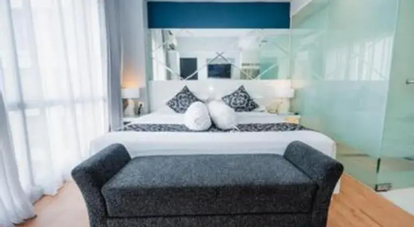 Bed in Grand Darmo Suite by AMITHYA Bed in Grand Darmo Suite by AMITHYA