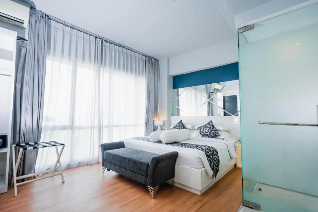 Bed in Grand Darmo Suite by AMITHYA