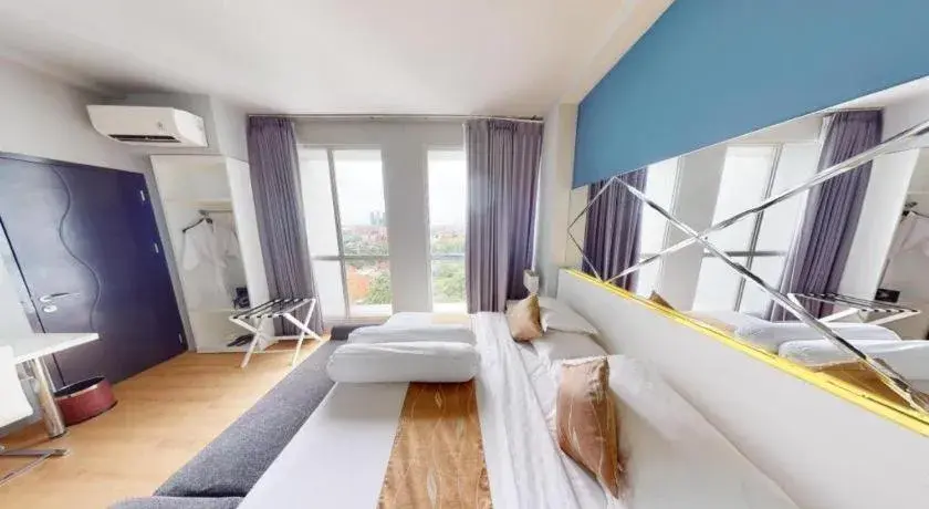 Bed in Grand Darmo Suite by AMITHYA Bed in Grand Darmo Suite by AMITHYA