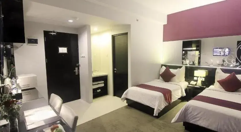 Bed in Grand Darmo Suite by AMITHYA Bed in Grand Darmo Suite by AMITHYA