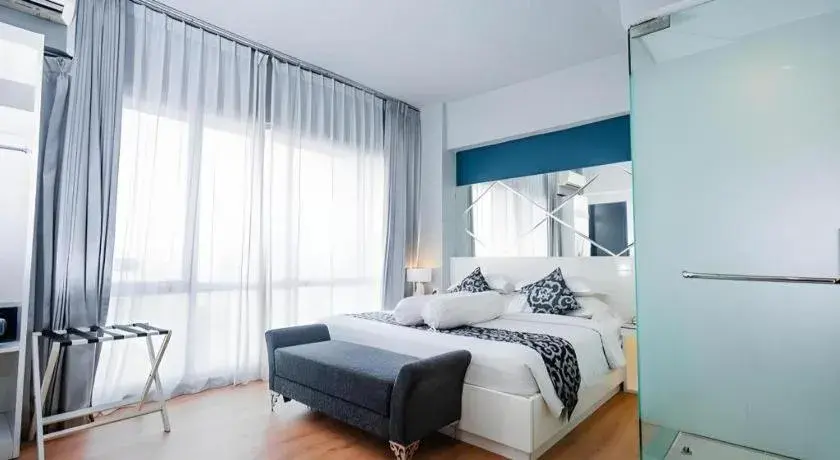 Bed in Grand Darmo Suite by AMITHYA Bed in Grand Darmo Suite by AMITHYA