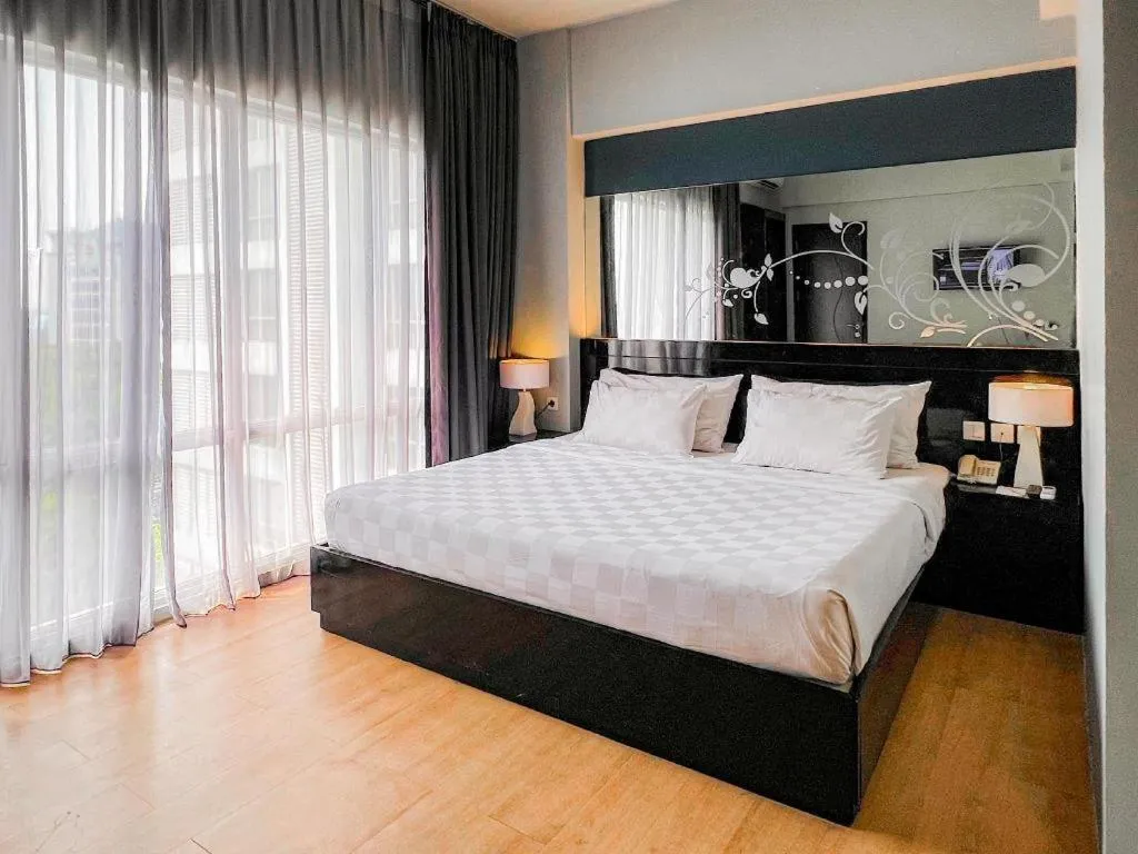 Bed in Grand Darmo Suite by AMITHYA