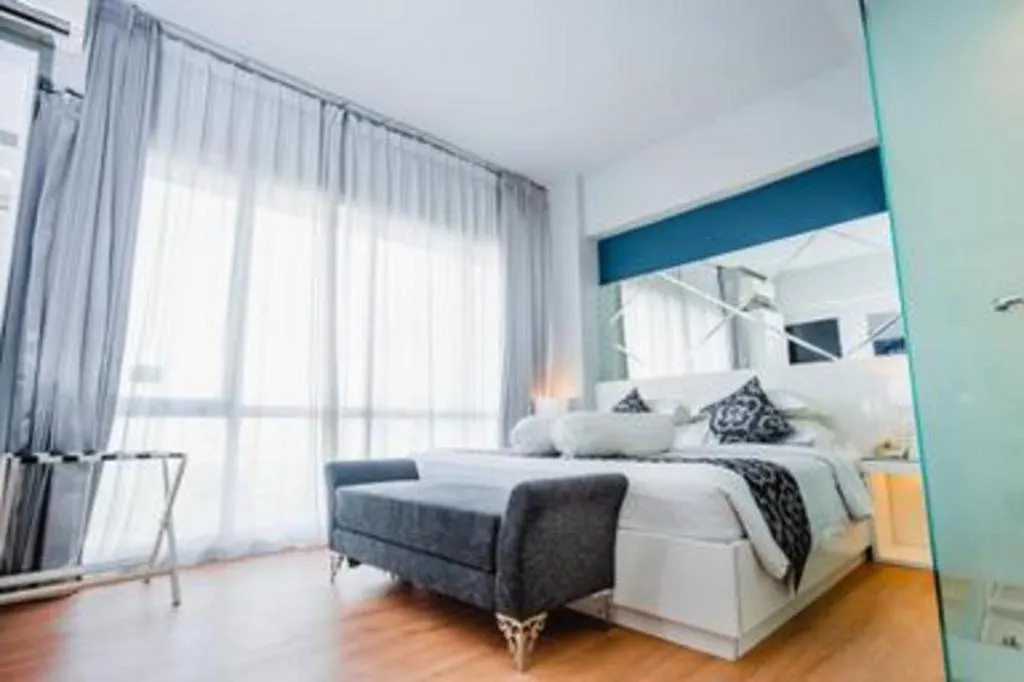 Bed in Grand Darmo Suite by AMITHYA