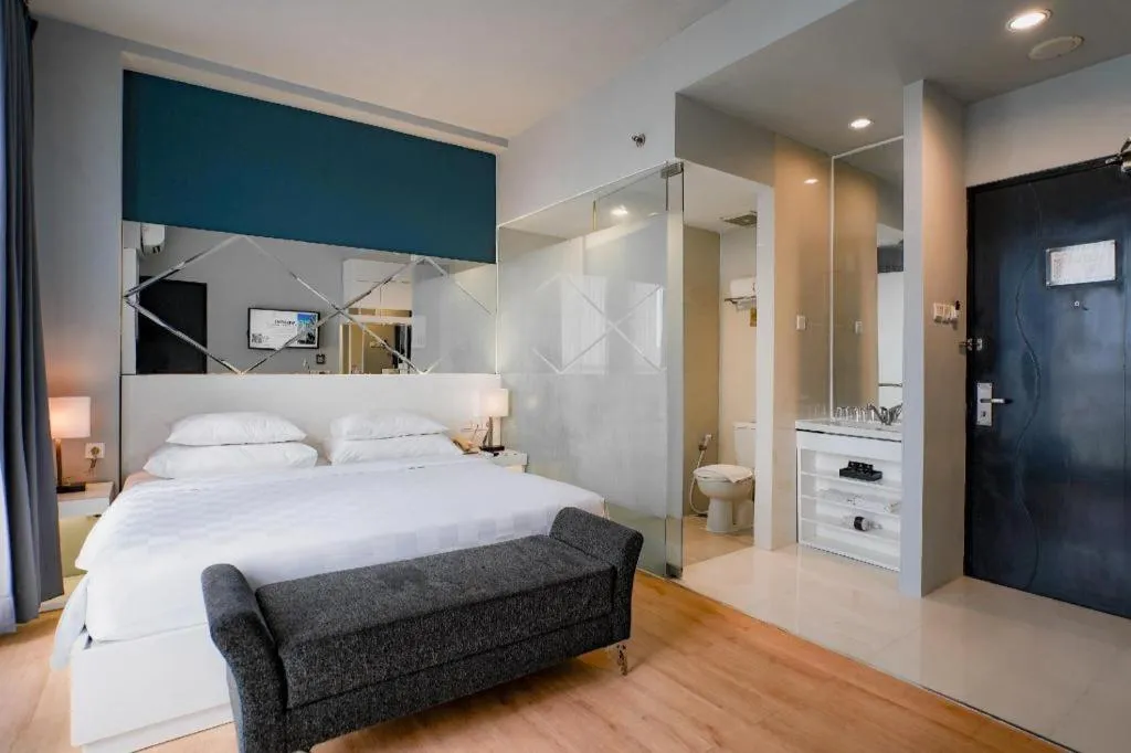 Bed in Grand Darmo Suite by AMITHYA