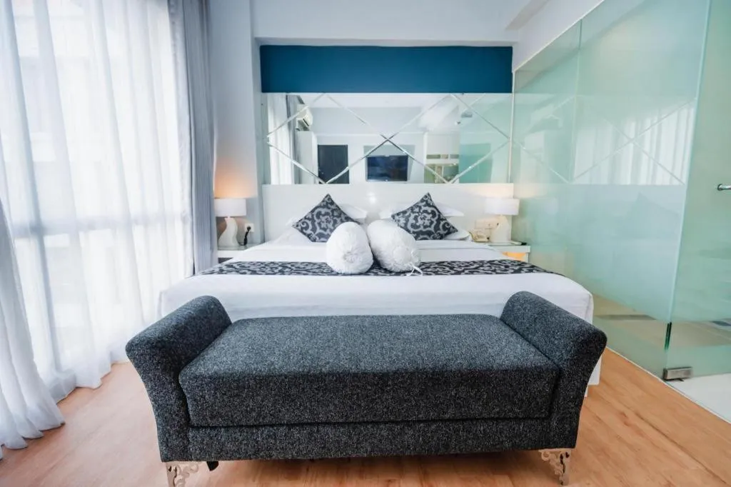 Bed in Grand Darmo Suite by AMITHYA