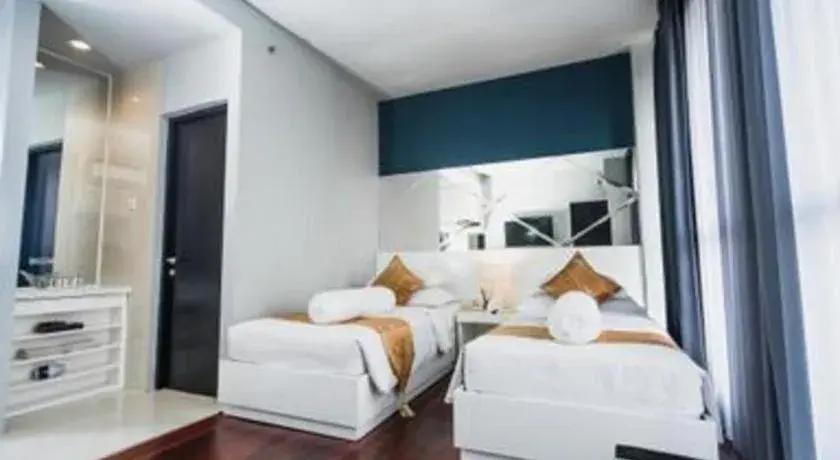 Bed in Grand Darmo Suite by AMITHYA Bed in Grand Darmo Suite by AMITHYA