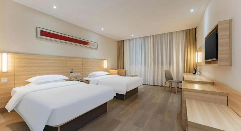 Bed in City Comfort Inn Enshi Shizhou Avenue