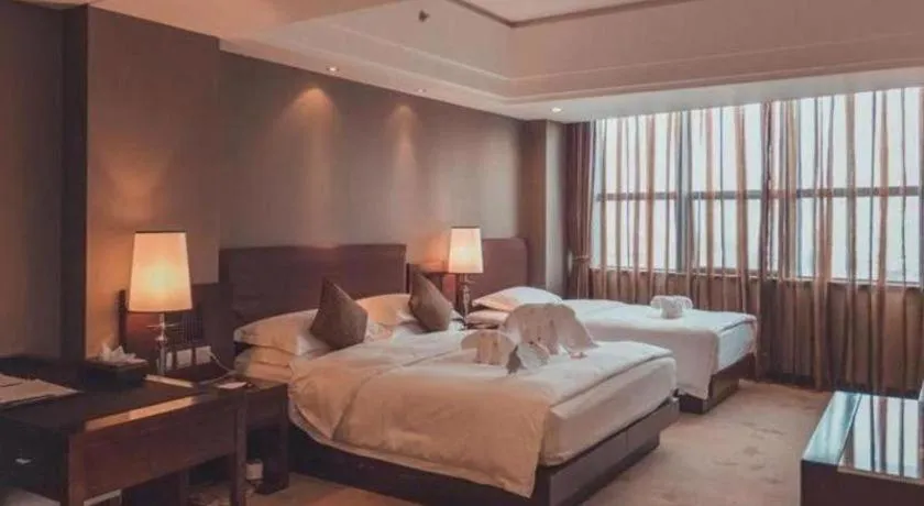 Bed in Kunming Wenhui Hotel