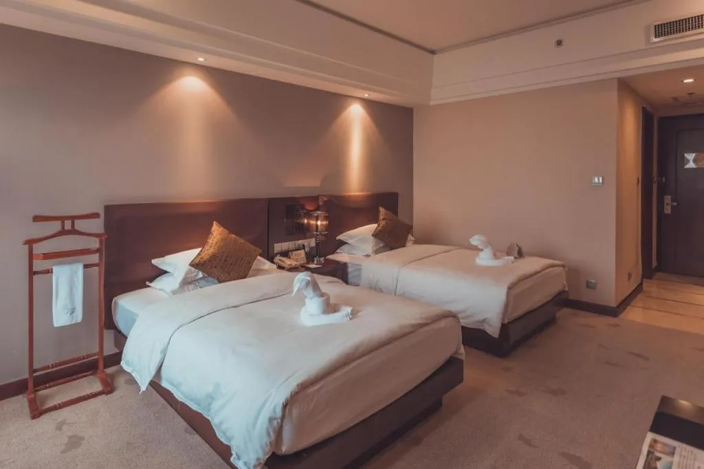 Bed in Kunming Wenhui Hotel