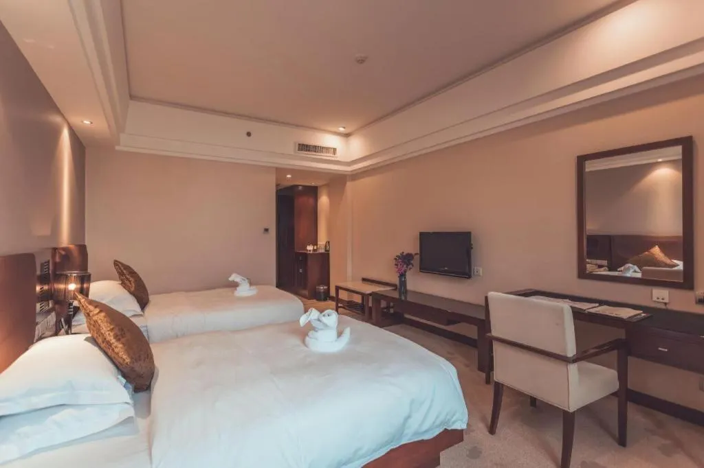 Bed in Kunming Wenhui Hotel