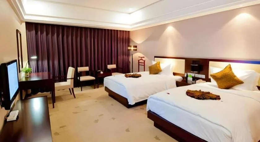 Bed in Kunming Wenhui Hotel