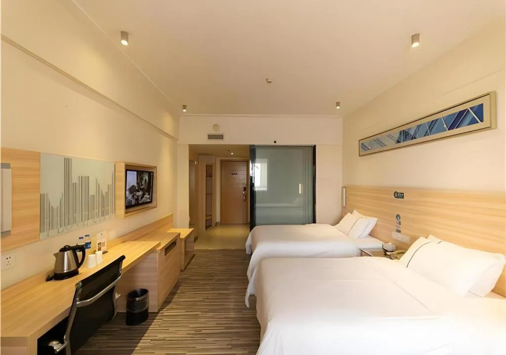 Bed in City Comfort Inn Yongzhou Jinshuiwan