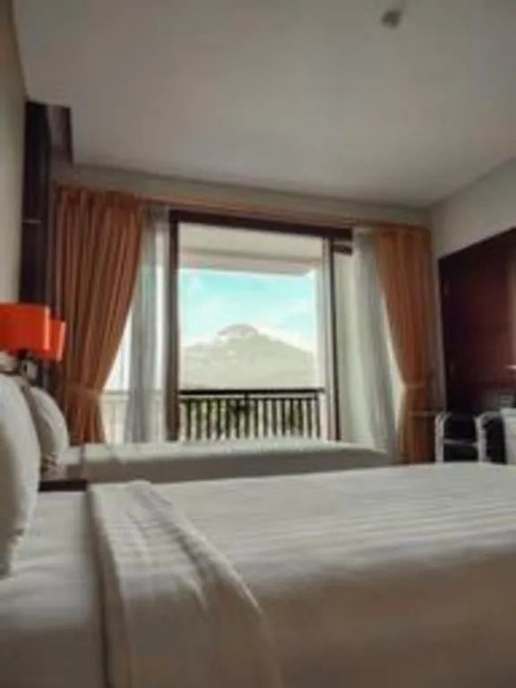 Bed in The Oxalis Regency Hotel