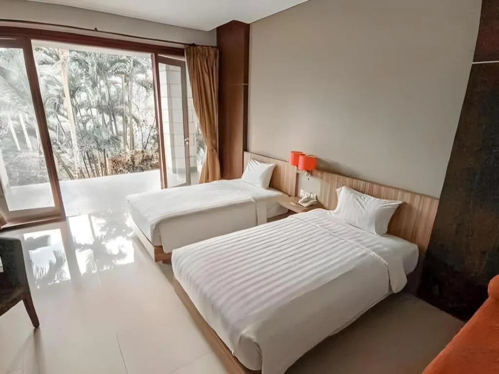 Bed in The Oxalis Regency Hotel