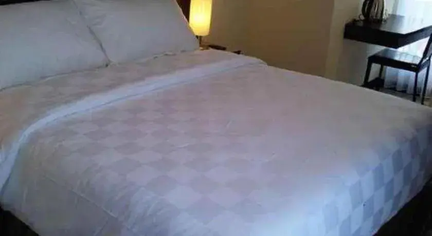 Bed in Sunbreeze Hotel Bed in Sunbreeze Hotel