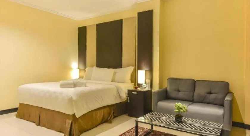 Bed in Sunbreeze Hotel