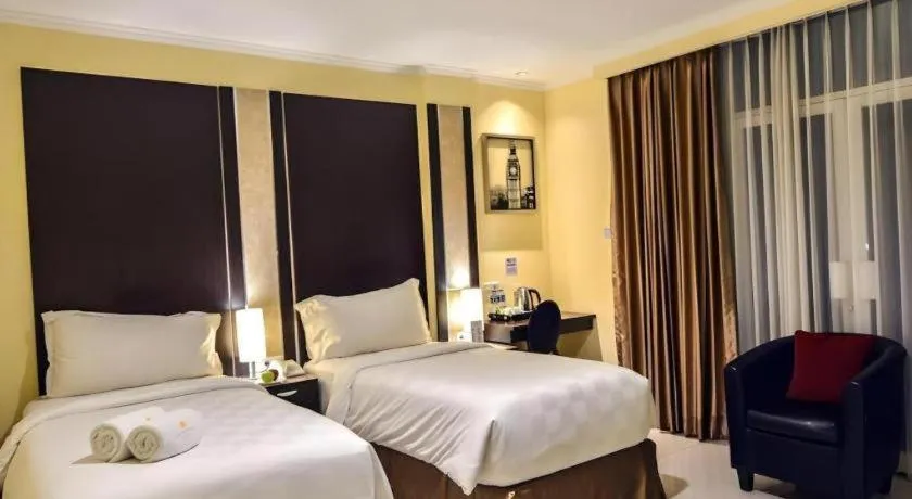 Bed in Sunbreeze Hotel